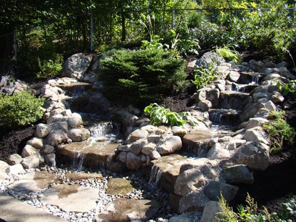 Water cascading into a Pond made of Natural Stone
