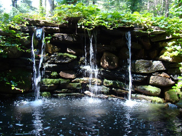 Waterfall into a pool made of stone
