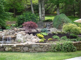 Landscaped Stone Garden with Waterfall and Pond